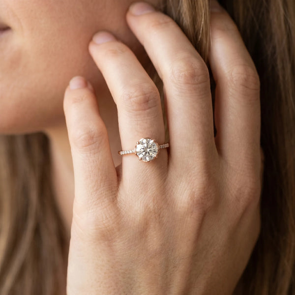 Rose gold Round Diamond Solitaire Ring with Pavé Accent Band and Four-Prong Setting