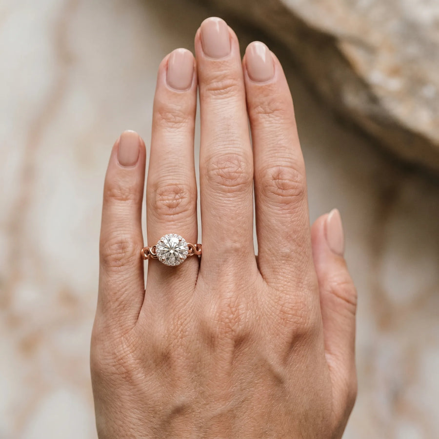 Rose gold Round Halo Solitaire with Scrollwork Band and Four-Prong Setting