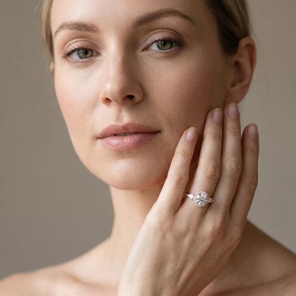 Rose gold Round Halo Three-Stone Diamond Ring with Pear Side Stones and Four-Prong Setting