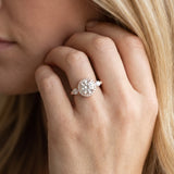 Rose gold Round Halo Three-Stone Diamond Ring with Pear Side Stones and Four-Prong Setting_15