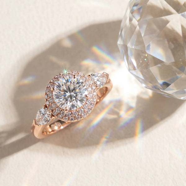 Rose gold Round Halo Three-Stone Diamond Ring with Pear Side Stones and Four-Prong Setting