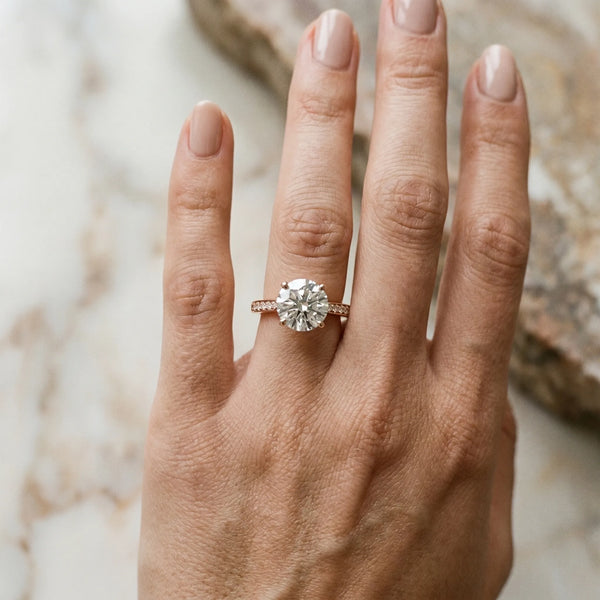 Rose gold Round Solitaire Diamond Ring with Four-Prong Setting and Tapered Band