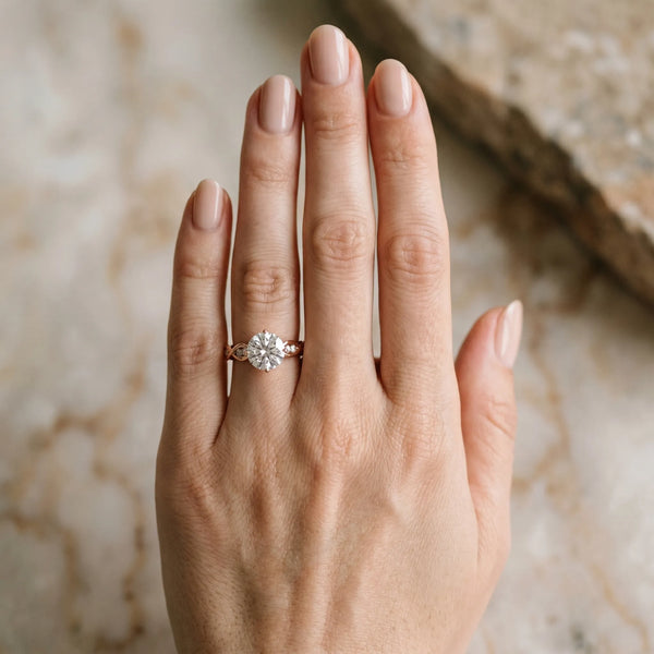 Rose gold Round Solitaire Twist Band with Leaf Prong Setting