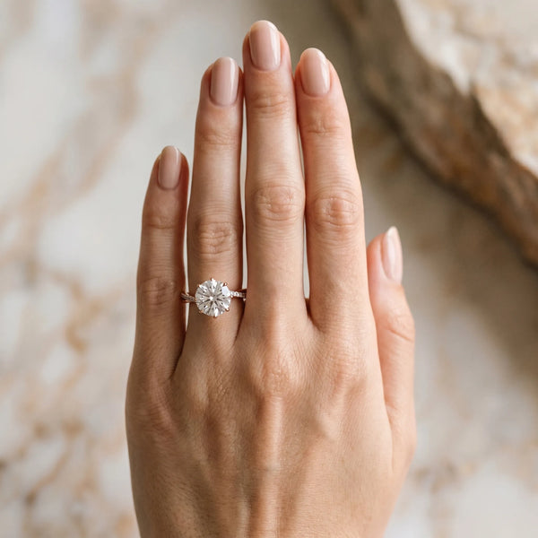 Rose gold Round Solitaire Twist Band with Pavé Diamonds and Four-Prong Setting