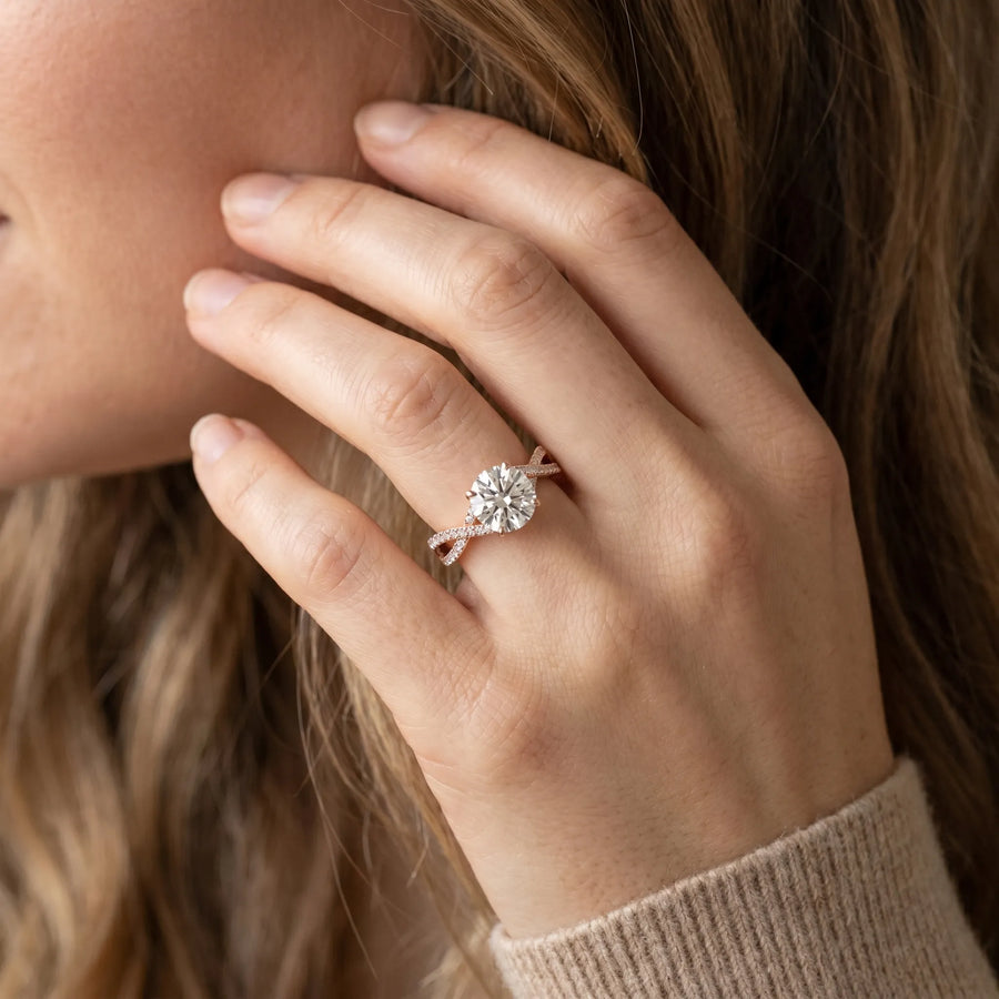 Rose gold Round Solitaire Twist Band with Pavé Setting and Four-Prong Mount