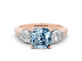 Rose gold Three-Stone Cushion Cut Aquamarine Ring with Pear Side Stones and Four-Prong Setting