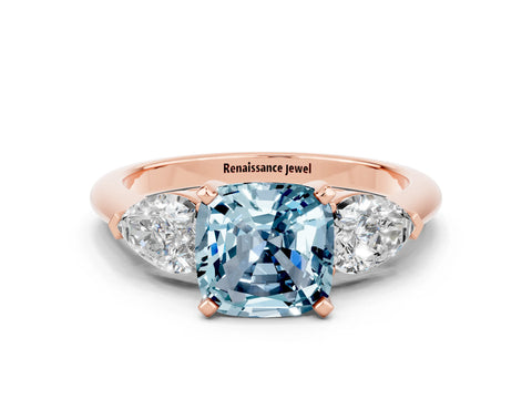 Rose gold Three-Stone Cushion Cut Aquamarine Ring with Pear Side Stones and Four-Prong Setting