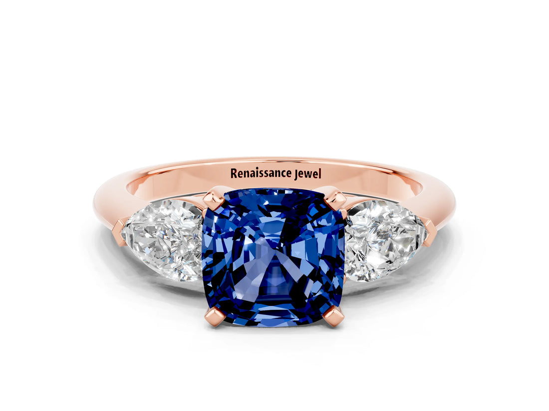 Rose gold Three-Stone Cushion Cut Blue Sapphire Ring with Pear Side Stones and Four-Prong Setting