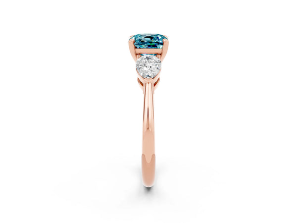 Rose gold Three-Stone Cushion Cut Blue Topaz Ring with Pear Side Stones and Four-Prong Setting