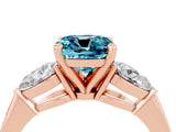 Rose gold Three-Stone Cushion Cut Blue Topaz Ring with Pear Side Stones and Four-Prong Setting_4