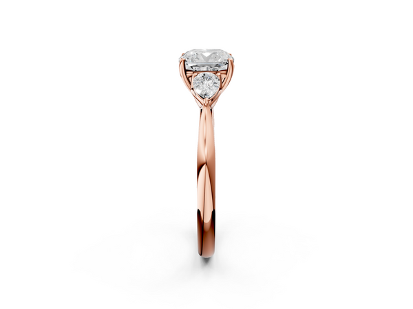 Rose gold Three-Stone Cushion Cut Diamond Ring with Pear Side Stones in Four-Prong Setting