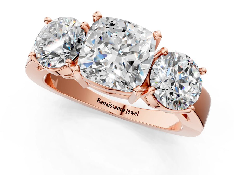Rose gold Three-Stone Cushion Cut Diamond Ring with Round Side Stones, Classic Band, and Four-Prong Setting