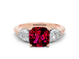 Rose gold Three-Stone Cushion Cut Garnet Ring with Pear Side Stones and Four-Prong Setting
