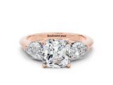 Rose gold Three-Stone Cushion Cut Moissanite Ring with Pear Side Stones and Four-Prong Setting