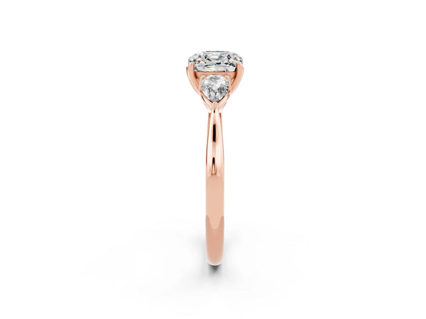 Rose gold Three-Stone Cushion Cut Moissanite Ring with Pear  Side Stones in Four-Prong Setting