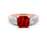 Rose gold Three-Stone Cushion Cut Ruby Ring with Pear Side Stones and Four-Prong Setting