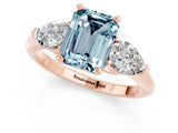 Rose gold Three-Stone Emerald Cut Aquamarine Ring with Pear Side Stones and Four-Prong Setting_1