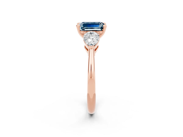 Rose gold Three-Stone Emerald Cut Aquamarine Ring with Pear Side Stones and Four-Prong Setting