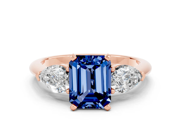 Rose gold Three-Stone Emerald Cut Blue Sapphire Ring with Pear Side Stones and Four-Prong Setting