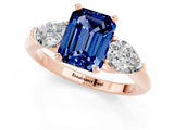 Rose gold Three-Stone Emerald Cut Blue Sapphire Ring with Pear Side Stones and Four-Prong Setting_1