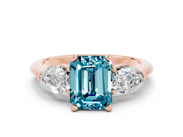 Rose gold Three-Stone Emerald Cut Blue Topaz Ring with Pear Side Stones and Four-Prong Setting