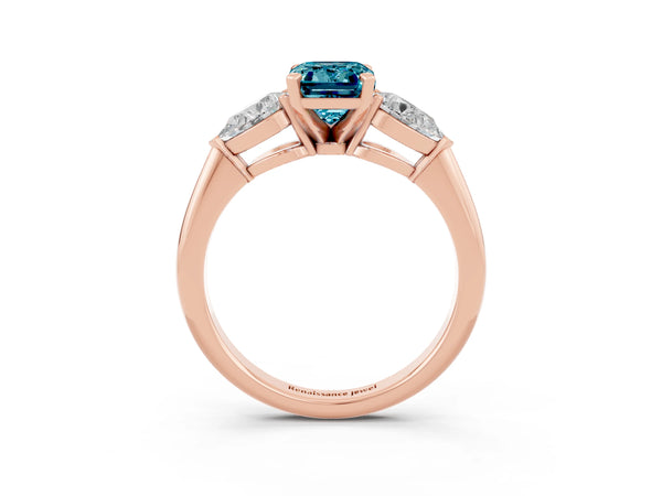 Rose gold Three-Stone Emerald Cut Blue Topaz Ring with Pear Side Stones and Four-Prong Setting