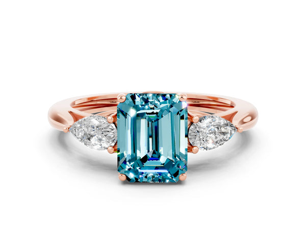 Rose gold Three-Stone Emerald Cut Blue Topaz Ring with Pear  Side Stones in Four-Prong Setting