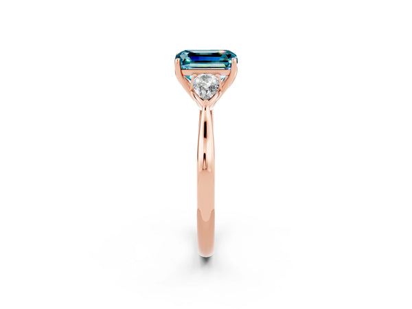 Rose gold Three-Stone Emerald Cut Blue Topaz Ring with Pear  Side Stones in Four-Prong Setting