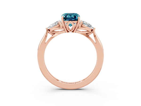 Rose gold Three-Stone Emerald Cut Blue Topaz Ring with Pear  Side Stones in Four-Prong Setting