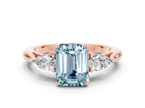 Rose gold Three-Stone Emerald Cut Cut Diamond Ring with Pear Side Stones in Four-Prong Setting