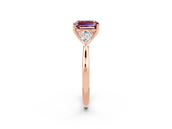 Rose gold Three-Stone Emerald Cut Cut Diamond Ring with Pear Side Stones in Four-Prong Setting