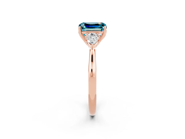 Rose gold Three-Stone Emerald Cut Cut Diamond Ring with Pear Side Stones in Four-Prong Setting