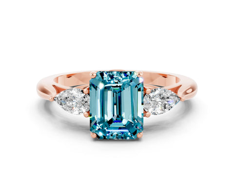 Rose gold Three-Stone Emerald Cut Cut Diamond Ring with Pear Side Stones in Four-Prong Setting