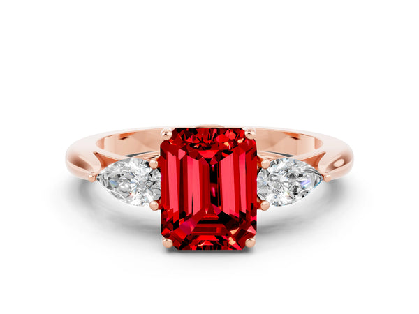 Rose gold Three-Stone Emerald Cut Cut Diamond Ring with Pear Side Stones in Four-Prong Setting