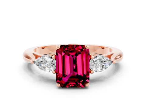 Rose gold Three-Stone Emerald Cut Cut Diamond Ring with Pear Side Stones in Four-Prong Setting