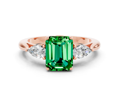 Rose gold Three-Stone Emerald Cut Cut Diamond Ring with Pear Side Stones in Four-Prong Setting