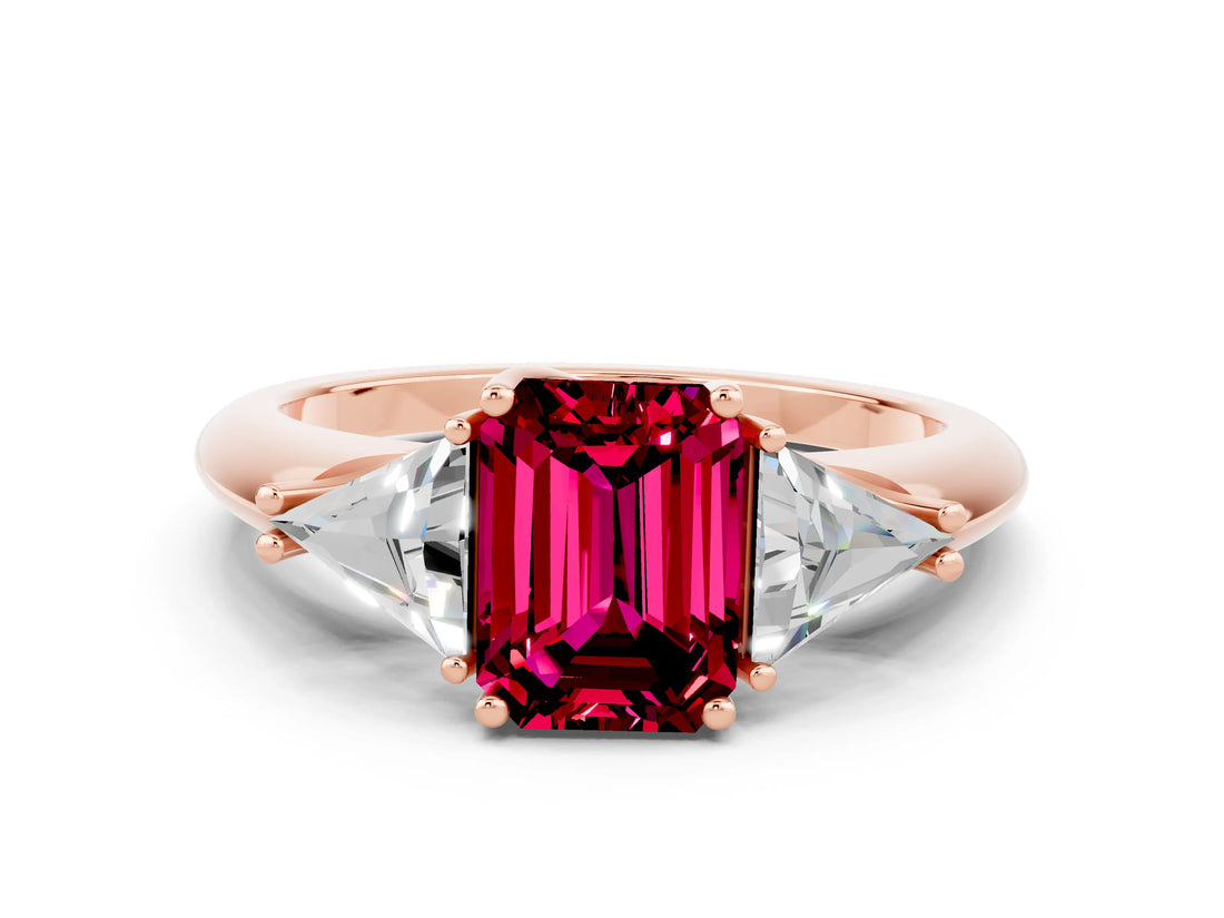 Rose gold Three-Stone Emerald Cut Cut Diamond Ring with Trillion Side Stones and Four-Prong Setting