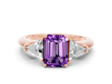 Rose gold Three-Stone Emerald Cut Cut Diamond Ring with Trillion Side Stones and Four-Prong Setting