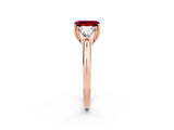 Rose gold Three-Stone Emerald Cut Cut Diamond Ring with Trillion Side Stones and Four-Prong Setting_2