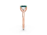 Rose gold Three-Stone Emerald Cut Cut Diamond Ring with Trillion Side Stones and Four-Prong Setting_2