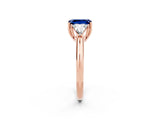 Rose gold Three-Stone Emerald Cut Cut Diamond Ring with Trillion Side Stones and Four-Prong Setting_2