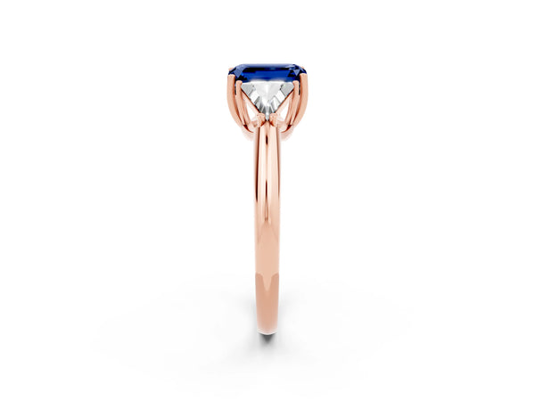 Rose gold Three-Stone Emerald Cut Blue Sapphire Engagement Ring with Trillion Side Stones and Prong Setting