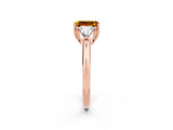 Rose gold Three-Stone Emerald Cut Cut Diamond Ring with Trillion Side Stones and Four-Prong Setting_2