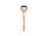 Rose gold Three-Stone Emerald Cut Cut Diamond Ring with Trillion Side Stones and Four-Prong Setting_2