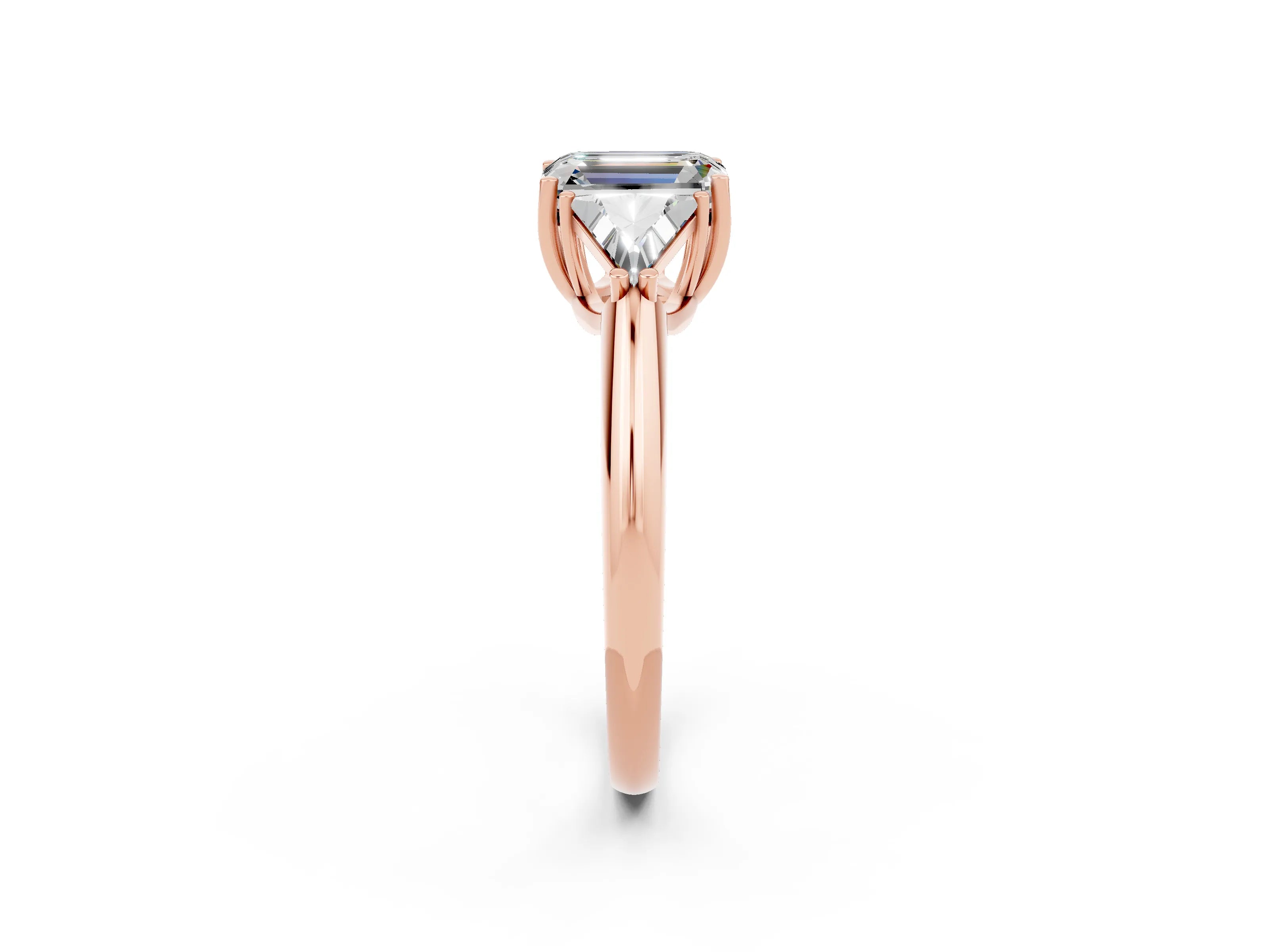 Rose gold Three-Stone Emerald Cut Cut Diamond Ring with Trillion Side Stones and Four-Prong Setting_2