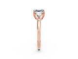 Rose gold Three-Stone Emerald Cut Cut Diamond Ring with Trillion Side Stones and Four-Prong Setting_2