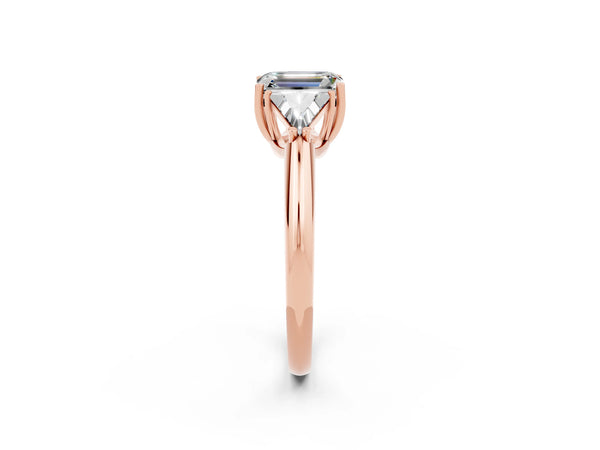 Rose gold Three-Stone Emerald Cut Moissanite Engagement Ring with Trillion Side Stones and Prong Setting