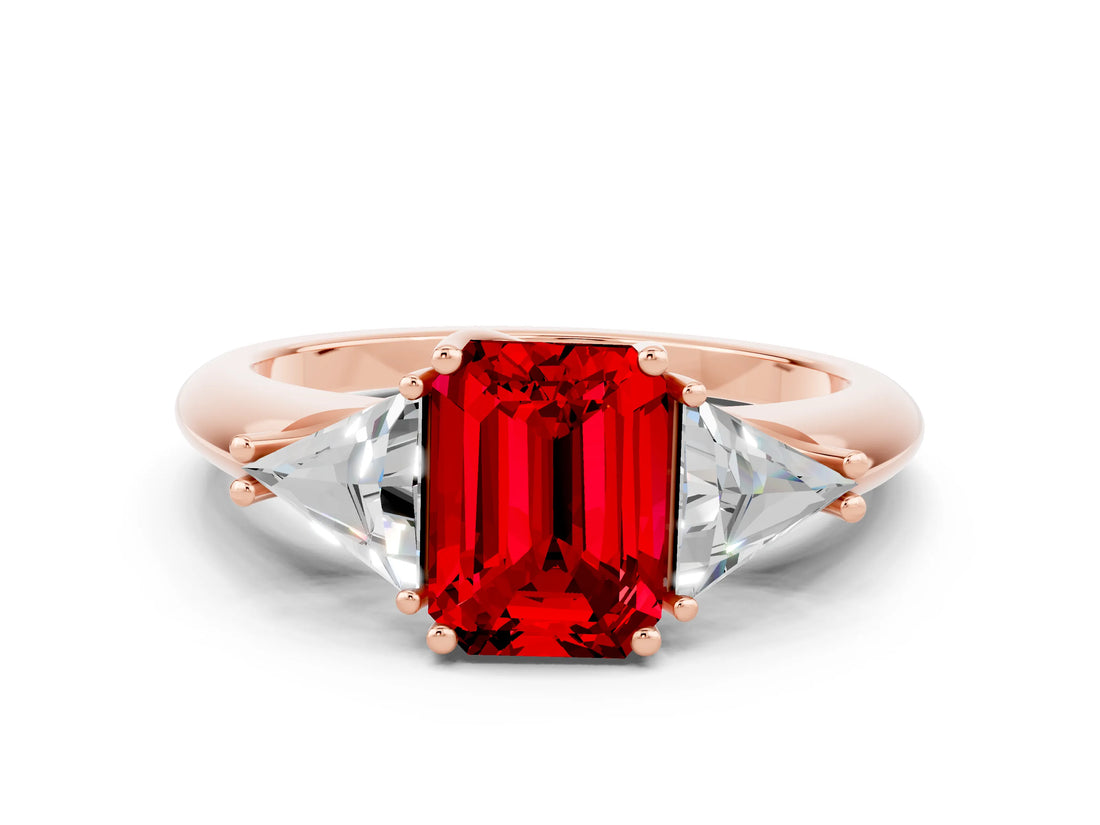 Rose gold Three-Stone Emerald Cut Cut Diamond Ring with Trillion Side Stones and Four-Prong Setting