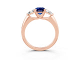 Rose gold Three-Stone Emerald Cut Cut Diamond Ring with Trillion Side Stones and Four-Prong Setting_3