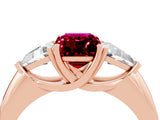 Rose gold Three-Stone Emerald Cut Cut Diamond Ring with Trillion Side Stones and Four-Prong Setting_4